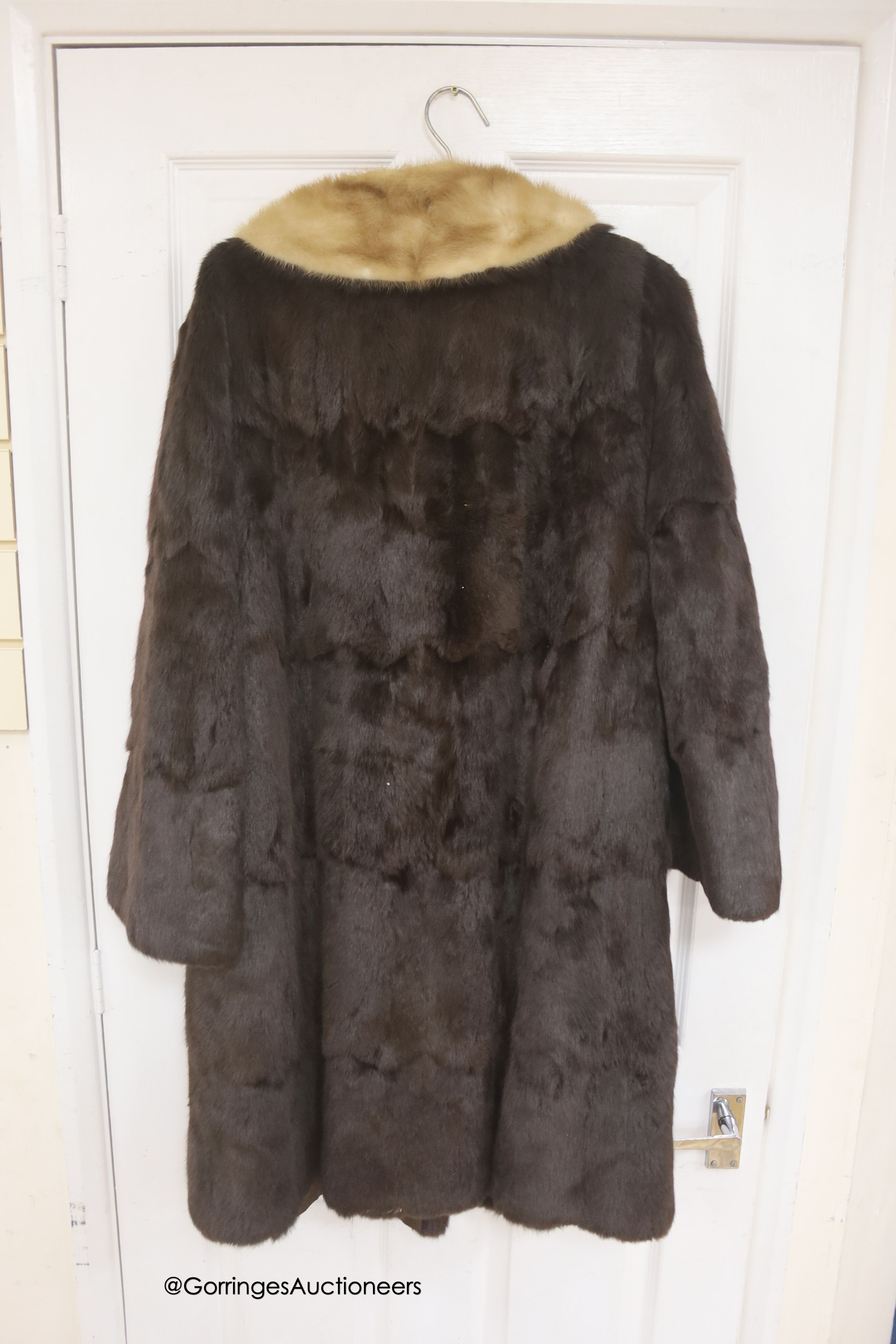 A ladies dark brown squirrel coat with blond mink collar by Baray Furs.
